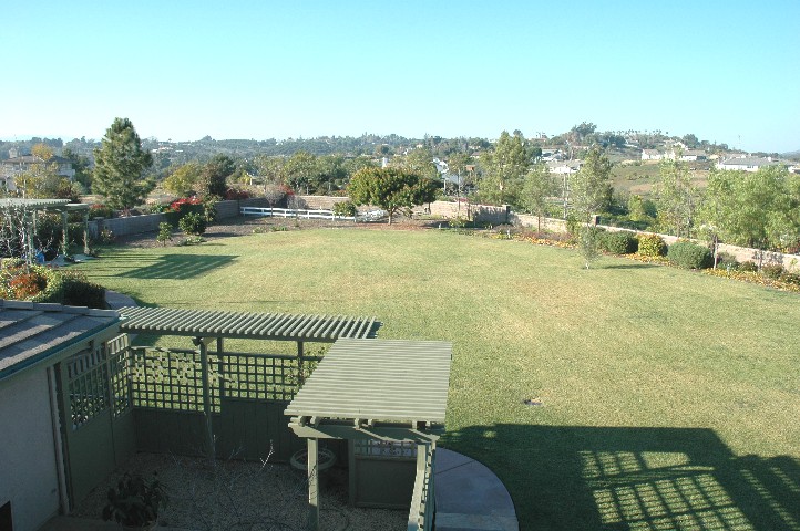 A truly flat useable wonderful walled and fenced yard...