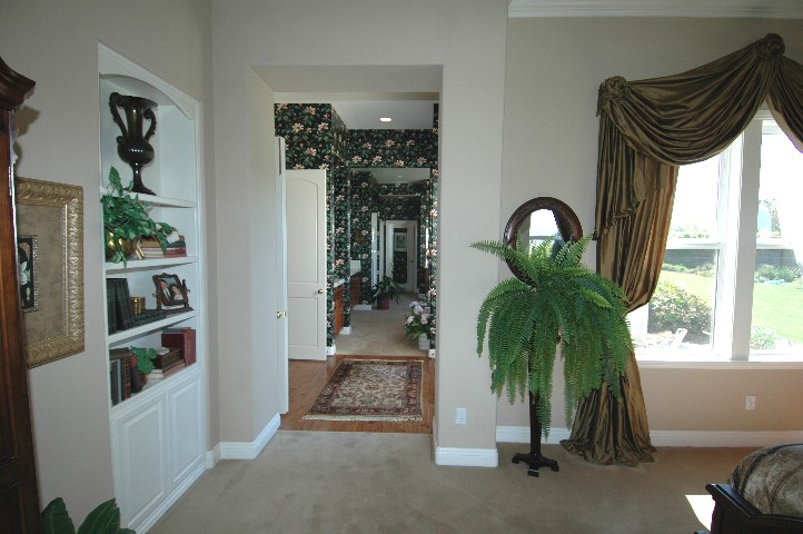 Wide Hall Access to the Bath Suite... and French Doors to a Patio..