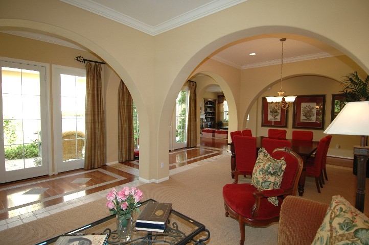 The wall of French Doors open the entire Interior to the Courtyard...