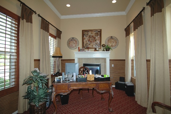 Just inside the Entry.... your Cozy Fireside Office... with view into the Center Courtyard