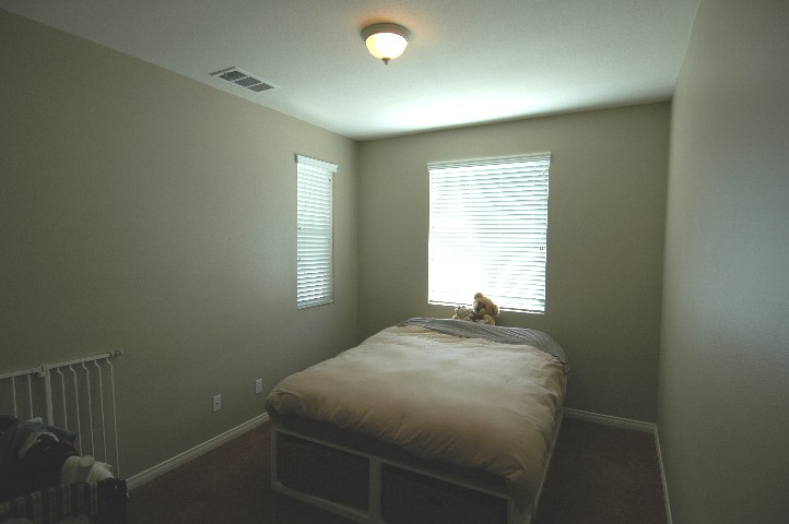 Shaded 5th ground floor guest bedroom... the baby is sleeping...