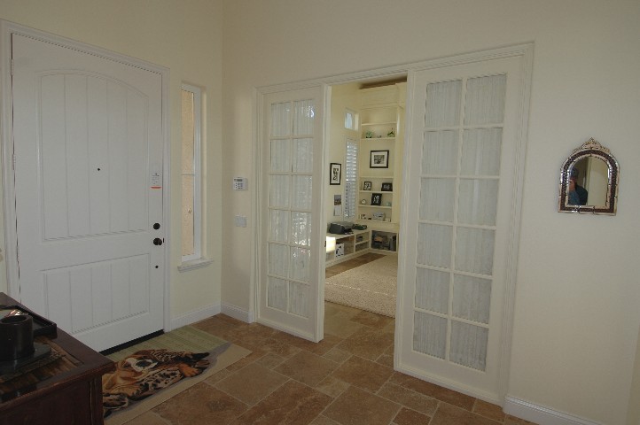 Impressive Tiled Entry with French Doors to the Office