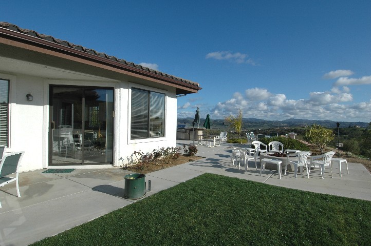 The rear of the home is a wall of Windows... to Privacy... and Views...