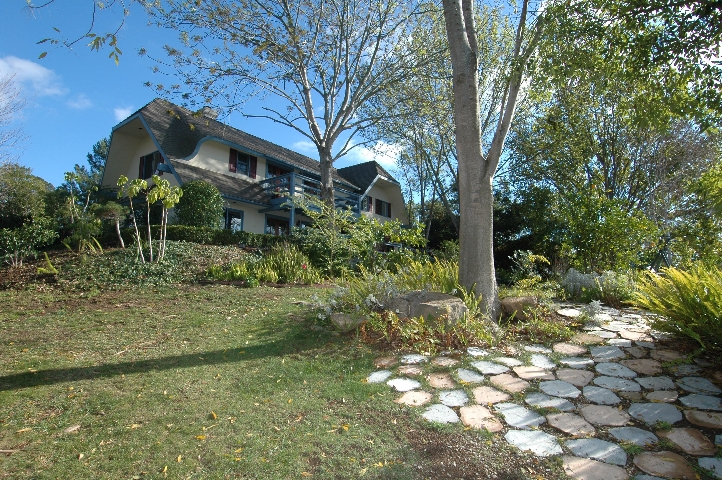 Mature Landscaping surrounds this Architectural Treasure