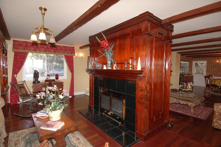 The dual sided Fireplace Enclosure and Mantles... hand carved by East Coast Artisan... Sal Marketa
