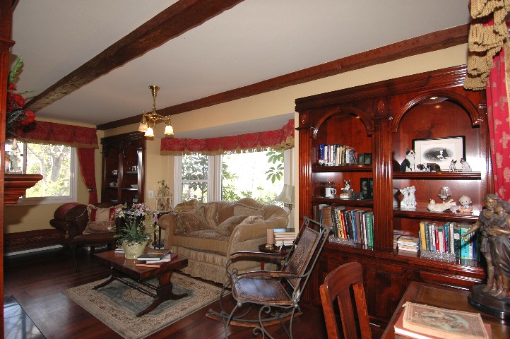 Opposite side of the fireplace... matching bookcases... and Bay Window to the Gardens...
