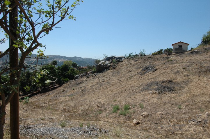 Southwest Corner is over there in the rocks... just surveyed and marked