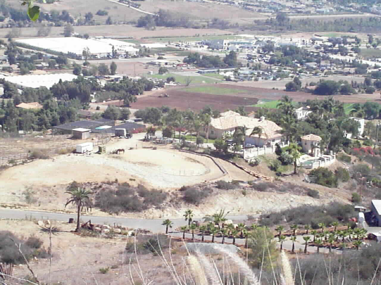 Aerial view from behind home.. showing Pad for Barn and Pad for Arena