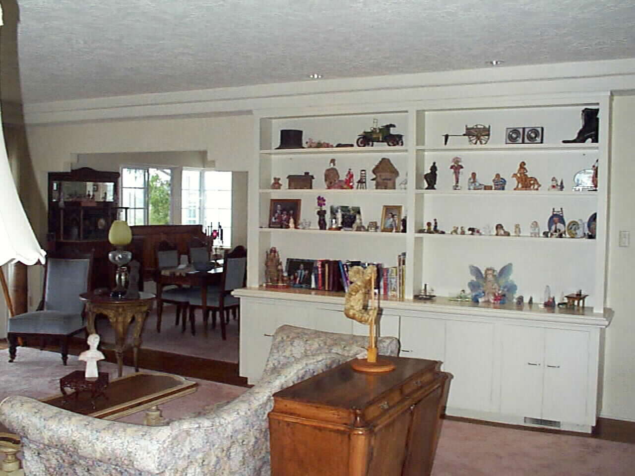 Original Living Room, Built in Bookcases and Roman Key Arch to Formal Dining Room