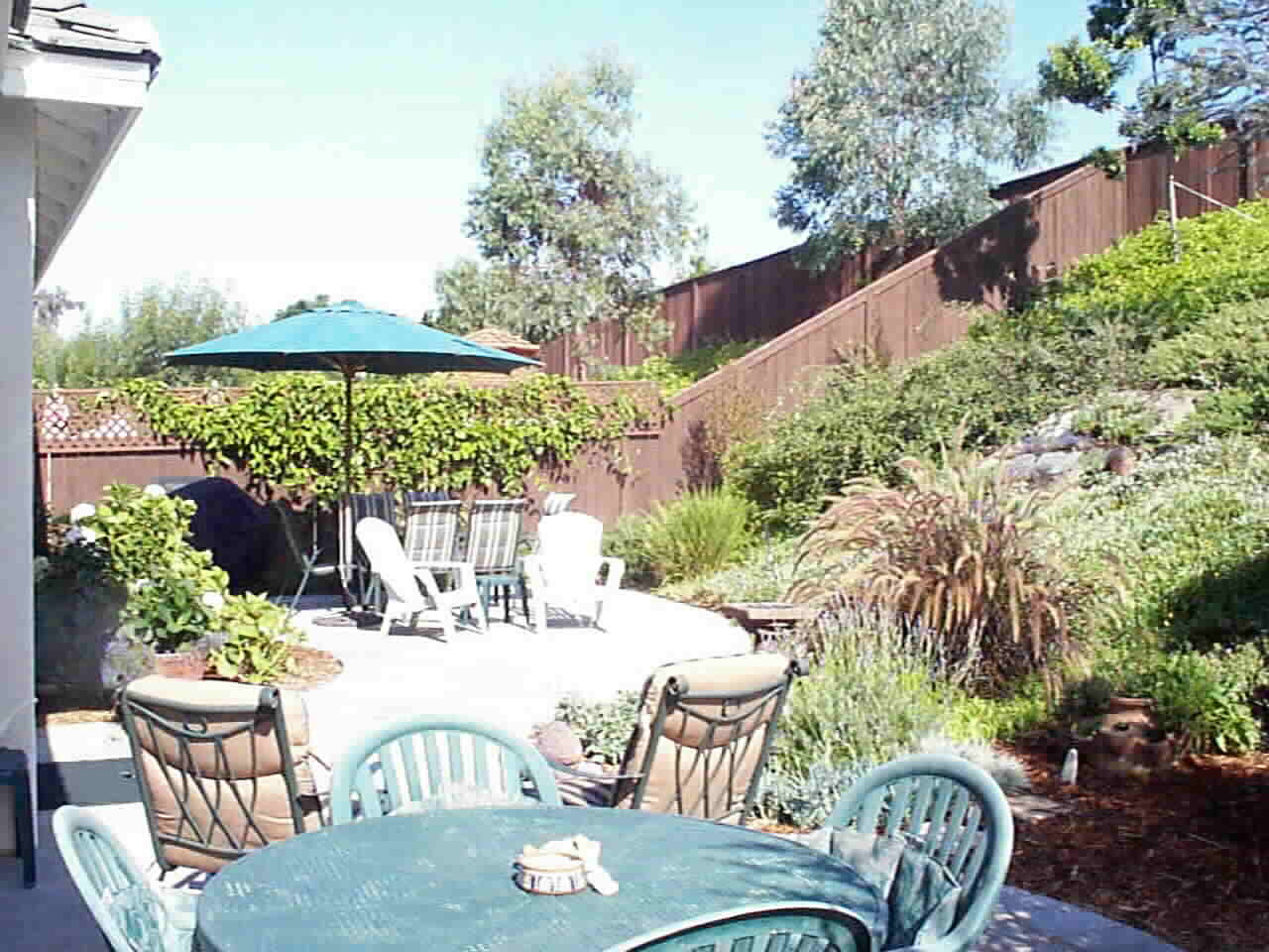 Private... Secluded... and Quiet! Planted to Low Mainenance.. and just enough space for a Tomato Plant or Two