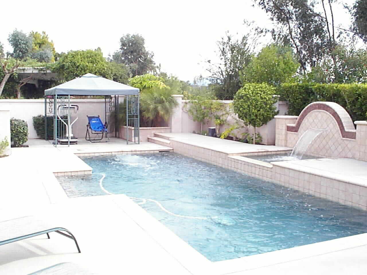 Walled Courtyard Setting... with covered Exercise Area & Swimjet Pool